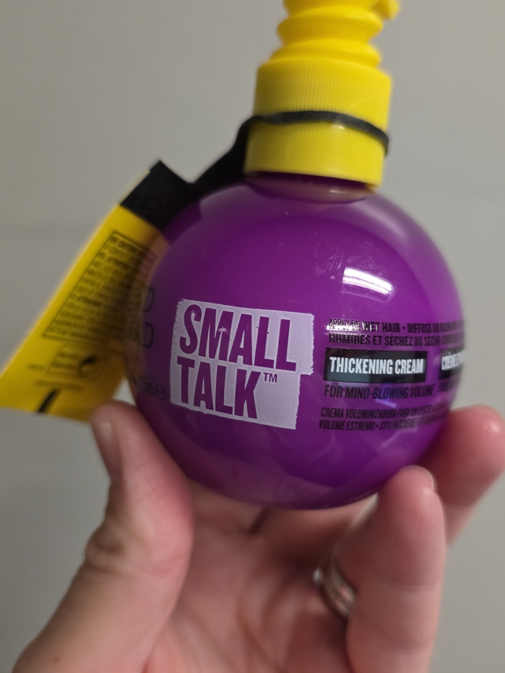 BedHead Small Talk Thickening Cream in Purple with Yellow Pump
